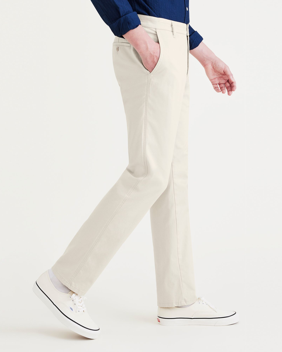 Side view of model wearing Sahara Khaki Men's Slim Fit Original Chino Pants.
