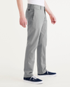 Side view of model wearing Sharkskin Alpha Chino Pants, Slim Fit.