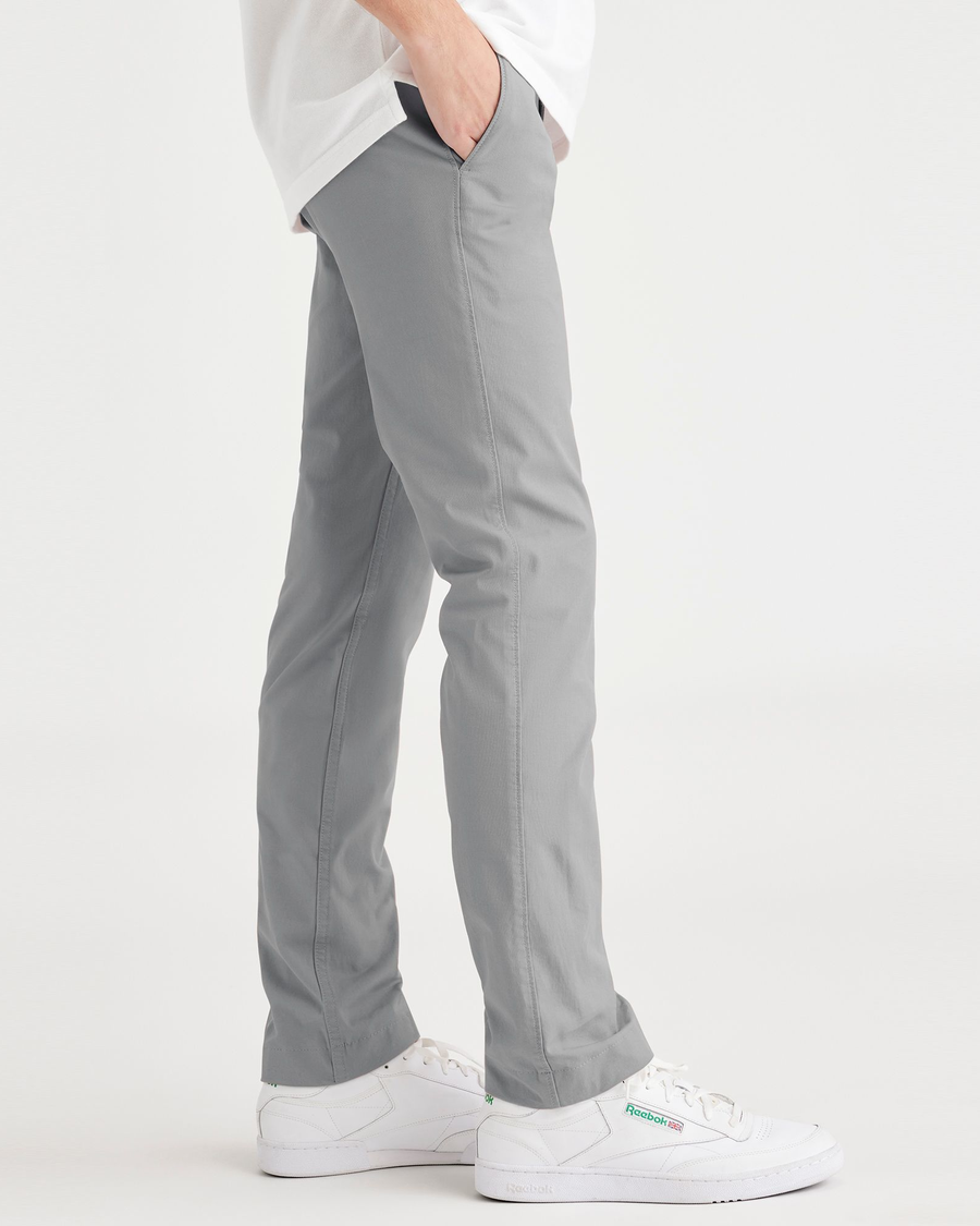 Side view of model wearing Sharkskin Men's Skinny Fit Smart 360 Flex California Chino Pants.