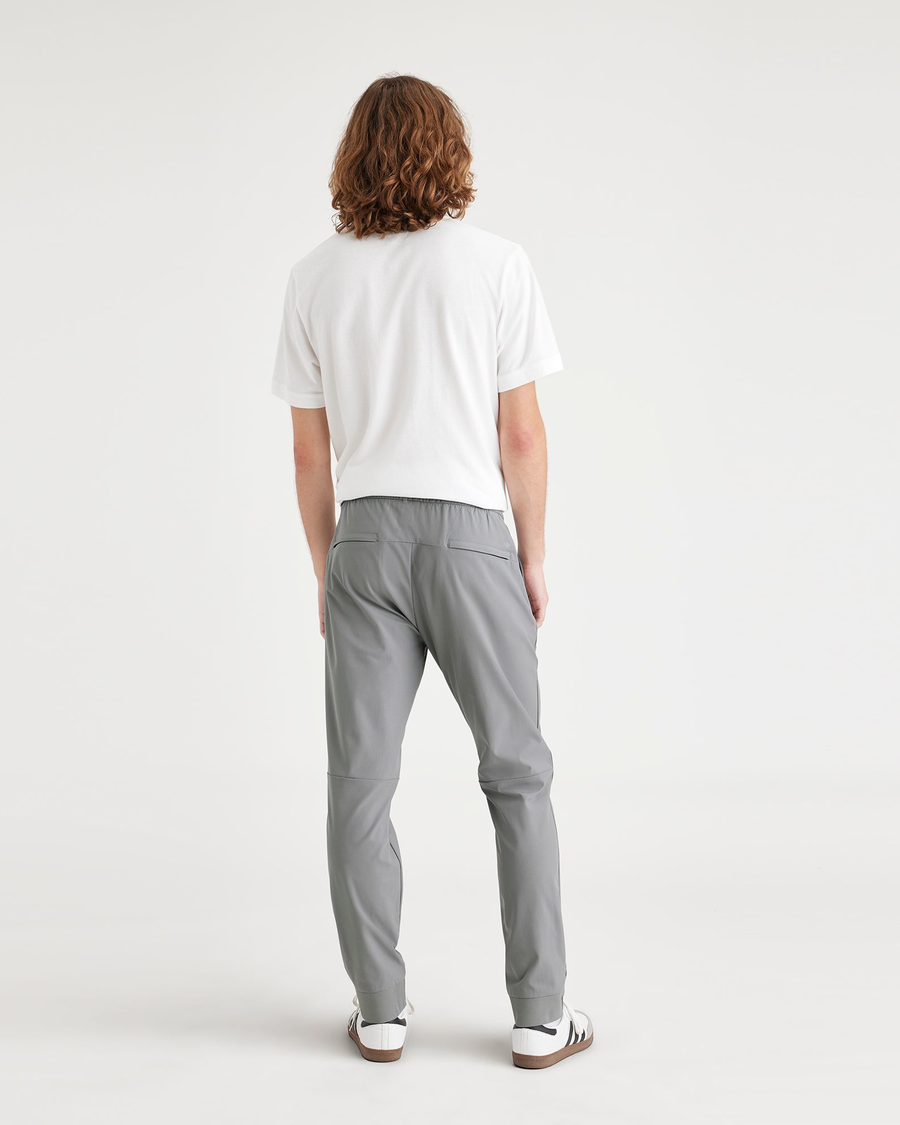 Back view of model wearing Sharkskin Men's Slim Fit Go Jogger Pants.