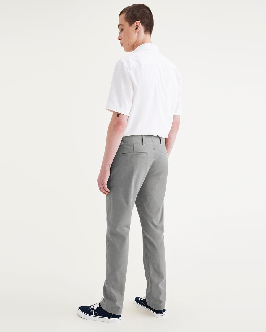 Back view of model wearing Sharkskin Men's Slim Fit Smart 360 Flex California Chino Pants.