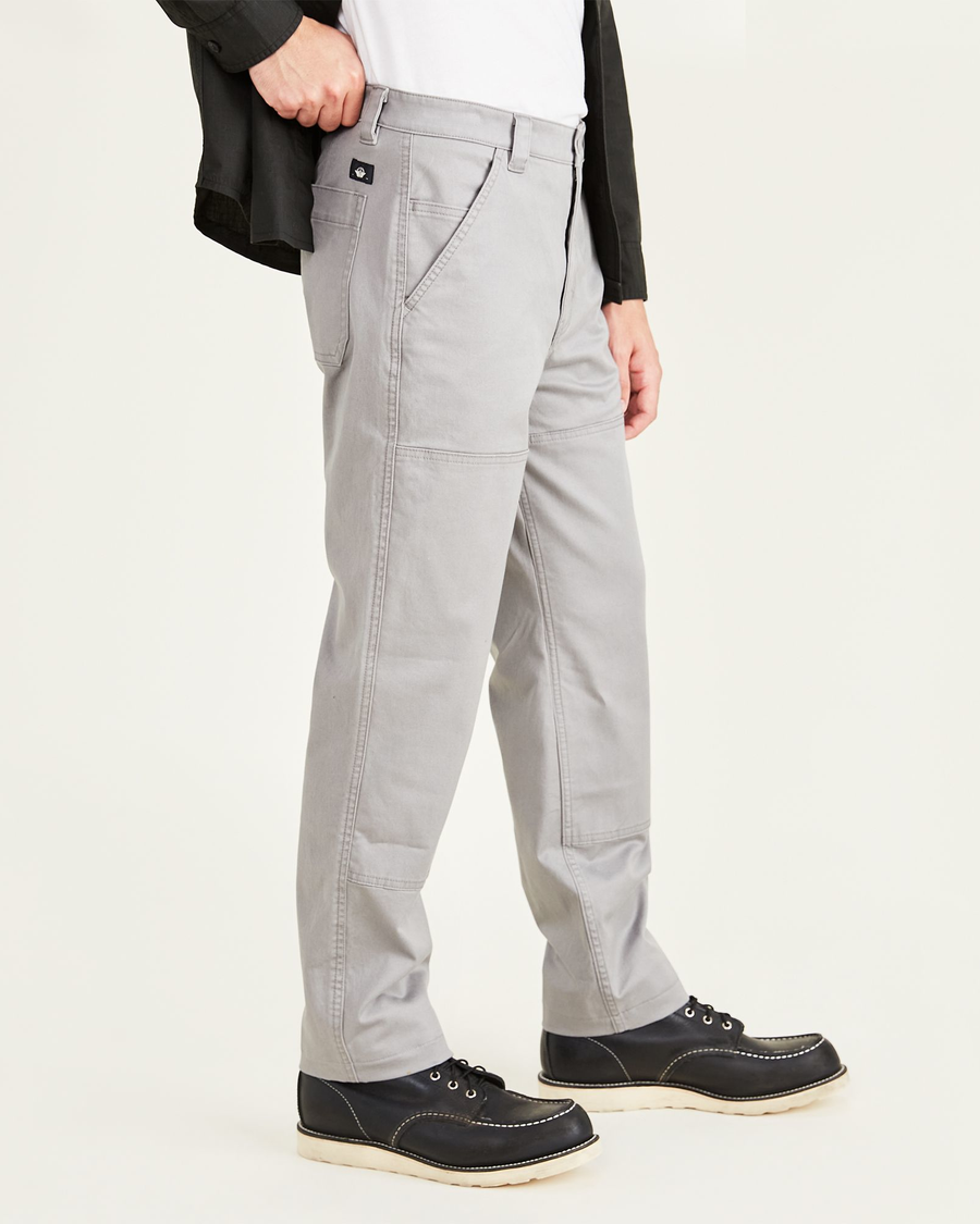 Side view of model wearing Sharkskin Men's Straight Fit Utility Pants.