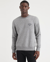 Front view of model wearing Smokestack Heather Men's  Regular Fit Crewneck Sweatshirt.