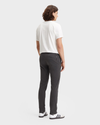 Back view of model wearing Steelhead Men's Skinny Fit Smart 360 Flex Alpha Khaki Pants.