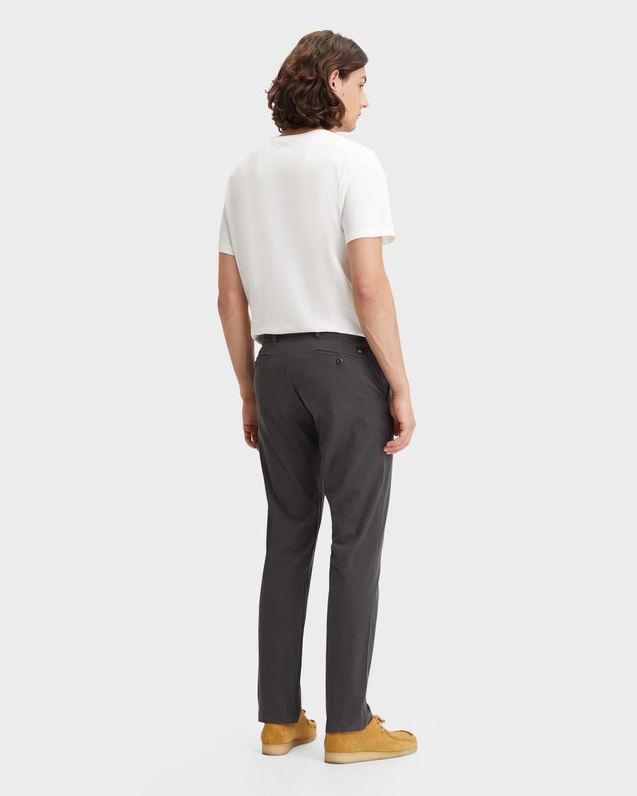 Back view of model wearing Steelhead Men's Slim Fit Smart 360 Flex Alpha Chino Pants.