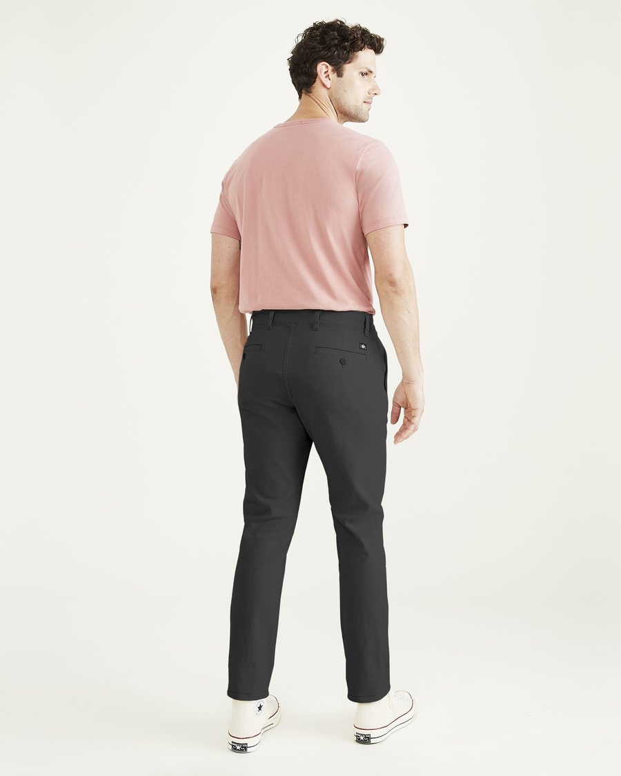 Back view of model wearing Steelhead Ultimate Chinos, Skinny Fit.