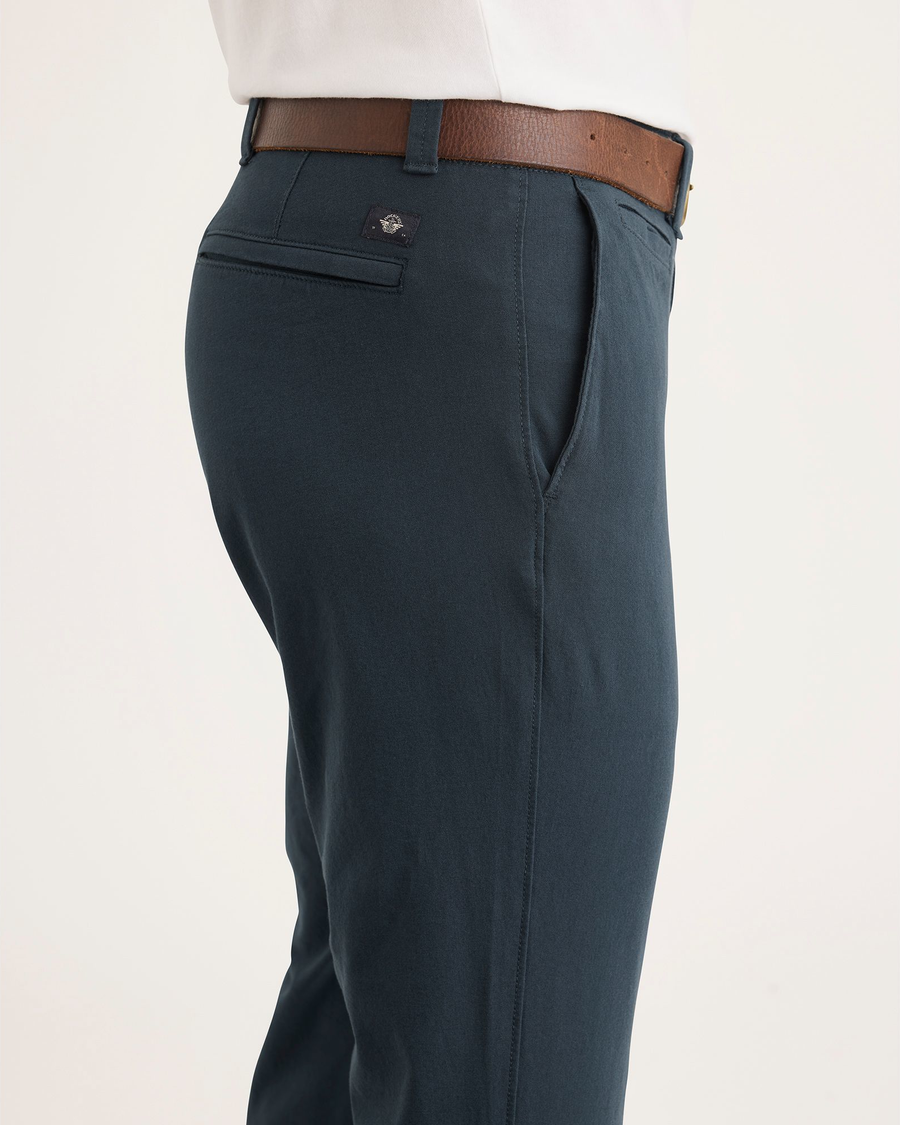 Side view of model wearing Stratified Sea Alpha Chino Pants, Skinny Fit.