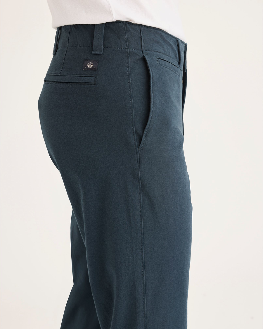 Side view of model wearing Stratified Sea Alpha Chino Pants, Slim Fit.