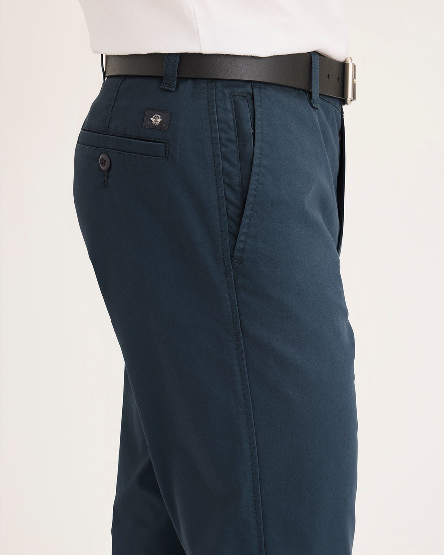 Side view of model wearing Stratified Sea Men's Slim Fit Smart 360 Flex Ultimate Chino Pants.