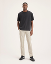 Front view of model wearing Summer Earth Men's Cargo Slim Tapered Fit Pants.