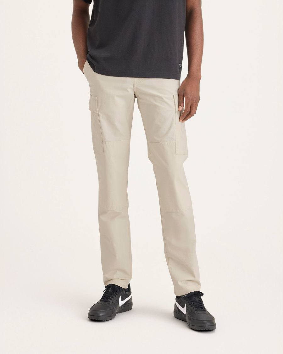 Front view of model wearing Summer Earth Men's Cargo Slim Tapered Fit Pants.