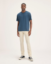 Front view of model wearing Summer Earth Men's Skinny Fit Smart 360 Flex California Chino Pants.