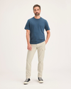 Front view of model wearing Summer Earth Men's Slim Tapered Fit Cargo Pants.