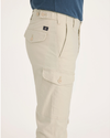 Side view of model wearing Summer Earth Men's Slim Tapered Fit Cargo Pants.