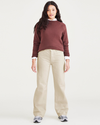 Front view of model wearing Tan Garment Dye Women's Relaxed Fit Mid-Rise Jeans.