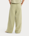 Back view of model wearing Tea Drawstring Pants.