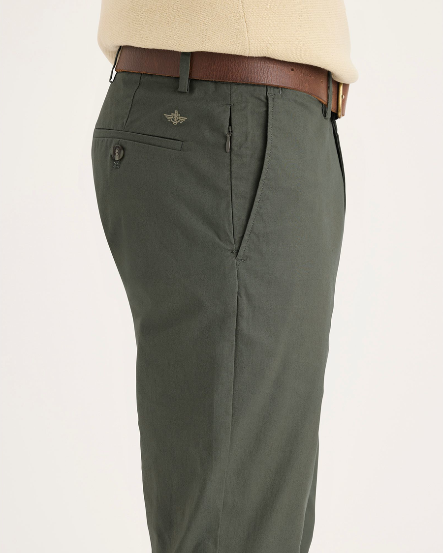 Side view of model wearing Tea Leaf Crafted Khaki Pants, Slim Fit.