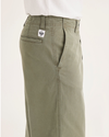 Side view of model wearing Tea Leaf Eighty-Six Alpha Chino Pants, Loose Fit.