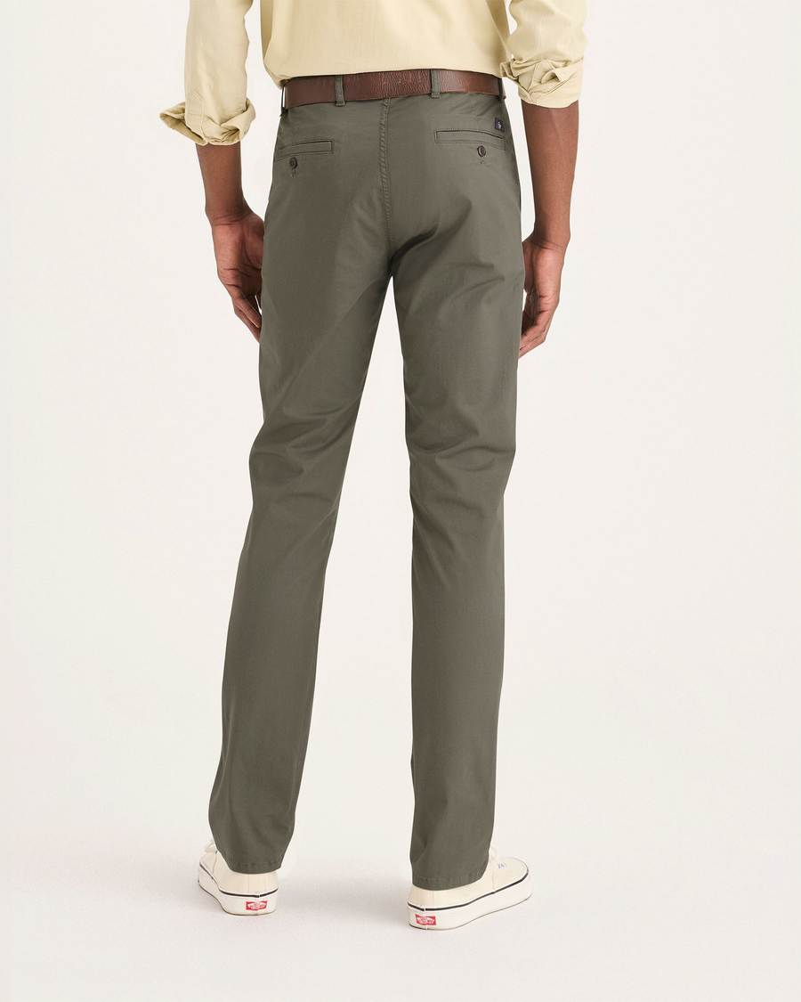 Back view of model wearing Tea Leaf Men's Slim Fit Original Chino Pants.