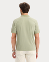 Back view of model wearing Tea Original Polo, Slim Fit.