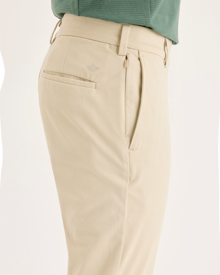 Side view of model wearing Tidal Foam Chino Go Activeflex, fit skinny.