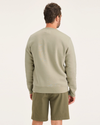 Back view of model wearing Traveler Tidal Foam (Buttercream) Men's  Regular Fit Crewneck Sweatshirt.