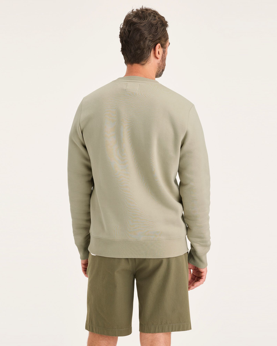 Back view of model wearing Traveler Tidal Foam (Buttercream) Men's  Regular Fit Crewneck Sweatshirt.