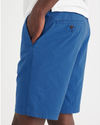 View of model wearing True Blue Men's Supreme Flex Modern Chino Short.