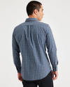 Back view of model wearing Upstream Vintage Indigo Men's Slim Fit Icon Button Up Shirt.