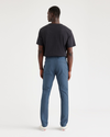 Back view of model wearing Vintage Indigo Men's Skinny Fit Smart 360 Flex California Chino Pants.