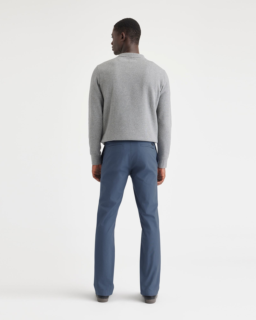 Back view of model wearing Vintage Indigo Men's Slim Fit Smart 360 Flex California Chino Pants.
