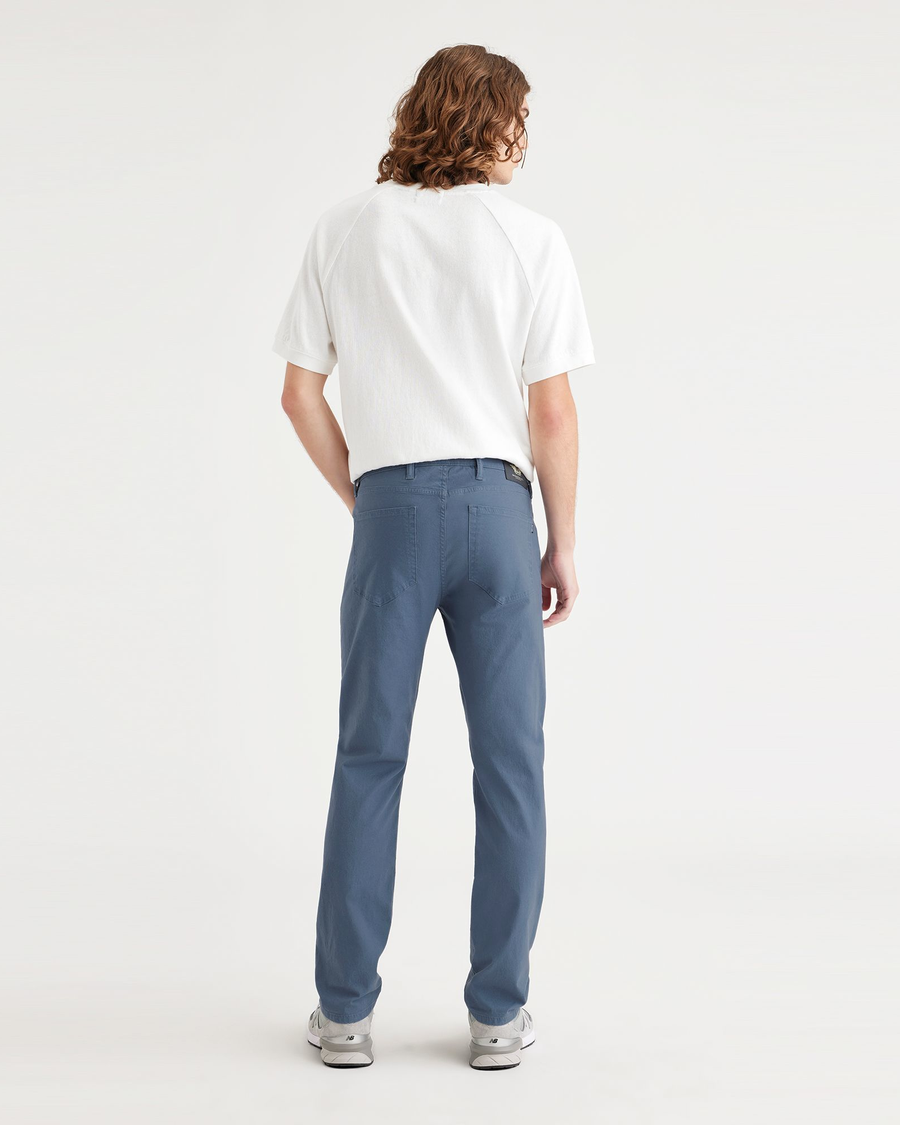 Back view of model wearing Vintage Indigo Men's Slim Fit Smart 360 Flex Jean Cut Pants.