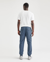 Back view of model wearing Vintage Indigo Men's Straight Tapered Fit Cargo Jogger Pants.
